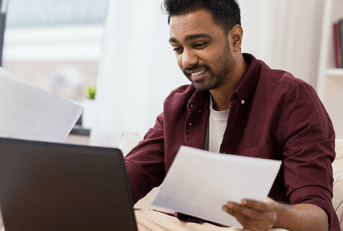 Man using H&amp;R Block tax software