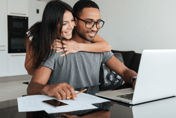 Couple comparing TaxAct vs Turbotax