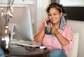 Happy woman talking on the phone
