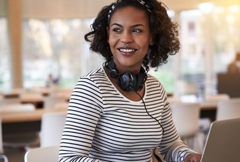 Happy woman working on laptop