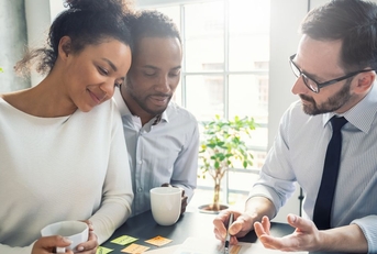 Couple discussing insurance with agent