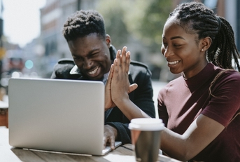 Students giving each other a high five