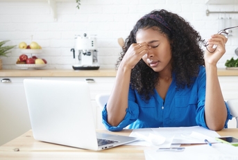 Young woman stressed about debt