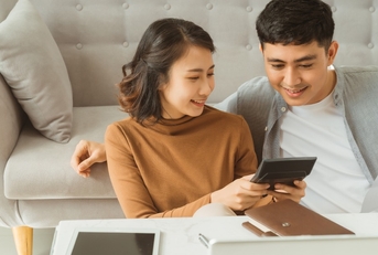 Couple calculating retirement savings