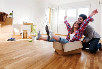 Happy couple moving into new house