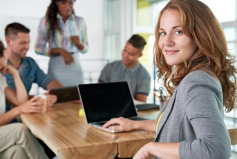 businesswoman smiling at desk