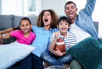 family watching super bowl on tv