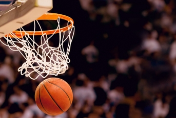 Basketball going through hoop