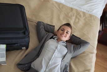 Woman enjoying her hotel room