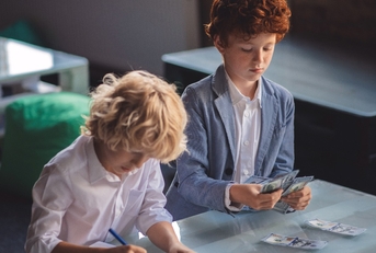 Two friends counting saved money and looking involved