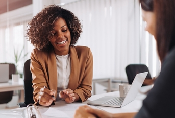 Woman talking with financial advisor