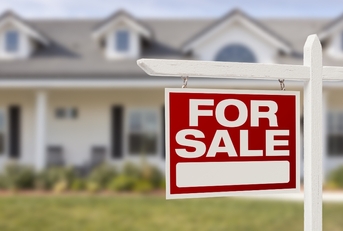 For sale sign outside house