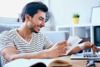 Man paying bills online