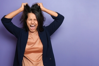 Woman stressed and pulling hair