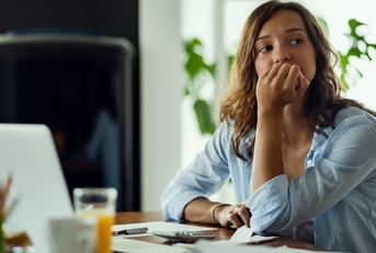 Woman thinking about bills
