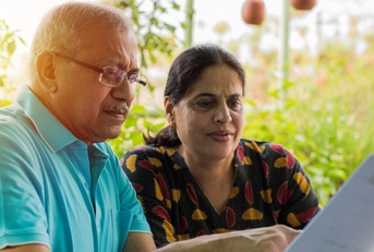 Senior couple reviewing bills