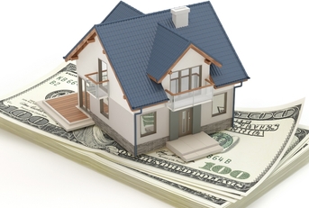 Model house sitting on money