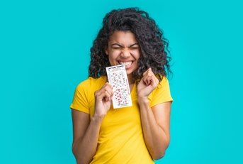 woman with lottery ticket