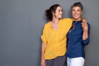 Two women hugging and smiling