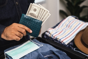 close up traveler hand man getting many cash for travel in the trip 