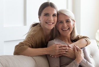 loving daughter hug mother people posing looking at camera