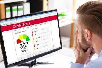 man looking at computer screen