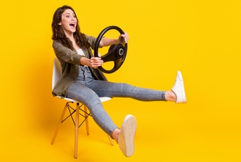 woman holding a driving wheel