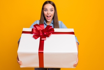 Woman holding large gift box