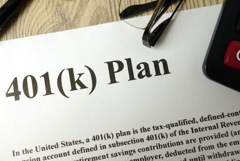 401k Plan with calculator pen and glasses