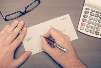 man writing a check