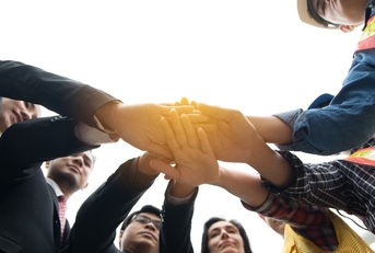 Hands put together to show unity and cooperation