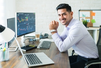 Young stock broker working at home