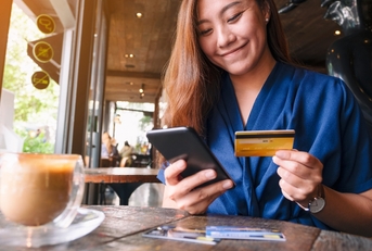 Woman buying something with credit card