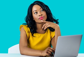 Woman working on computer and thinking