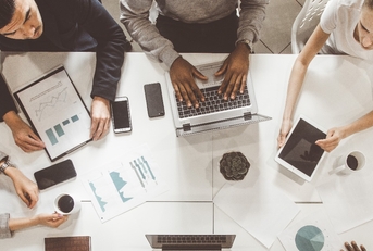 team of young office workers graph