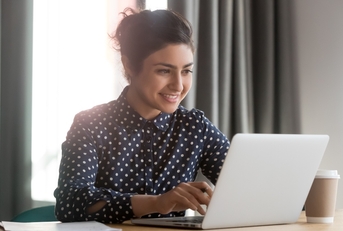 woman researching on her laptop