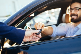 Man receiving keys for car