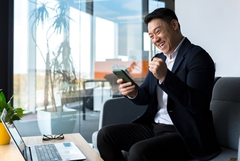 man excited in an airport lounge