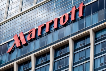 The exterior of a Marriott hotel. 