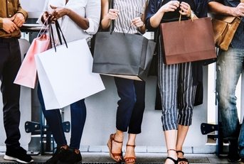 several people holding shopping bags