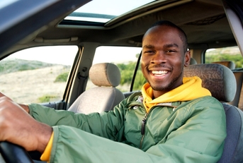 adult man driving a car