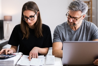 couple doing taxes and family budget