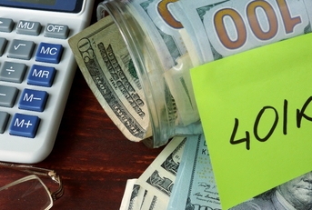 jar with label 401k and money on the table