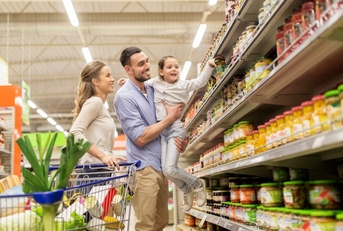 happy family at the grocery store shopping