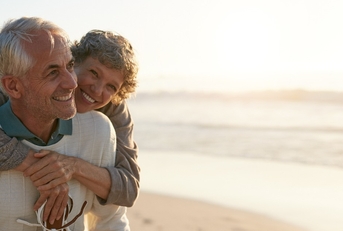 senior couple having fun at the beach