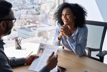 job interview between businessman hr director and female applicant