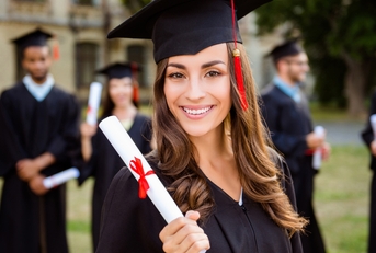female graduate with diploma in hand