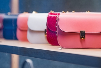 woman purses in a store in Paris