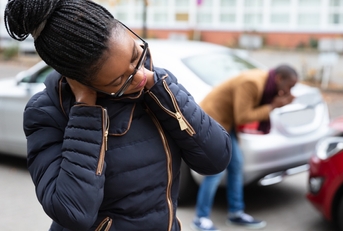 Woman holding her neck