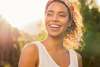 woman smiling at sunset